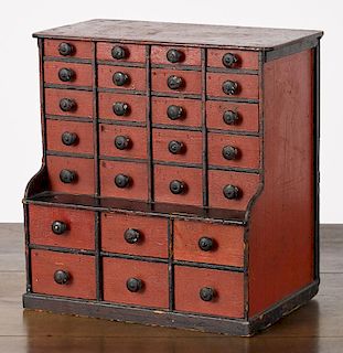 Painted pine spice chest, 19th c., retaining its original red and black surface, 14 3/4'' x 13''.