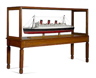 Large model of the cruise ship Queen Mary, by Lannan Ship Model Co., Boston, with mahogany stand