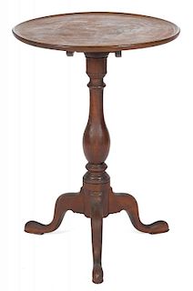 Pennsylvania Queen Anne walnut candlestand, late 18th c., with a tilting dish top, 28 1/2'' h., 20''