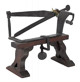 Wrought iron apple peeler, 19th c., with allover stamped star decoration, mounted on a later walnu