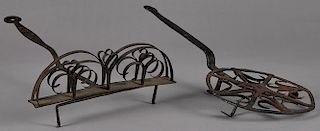 Two pieces of wrought iron, ca. 1800, one a toaster with repeated heart design, 20 1/2'' l., the ot