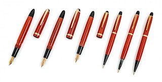 A Collection of Six Montblanc Coral Red Writing Insrtuments Length of first 5 1/4 inches.