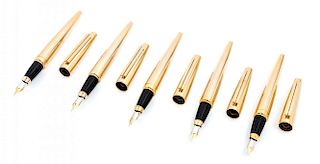 A Group of Five S.T. Dupont Gold-Plated Ellipsis Fountain Pens
