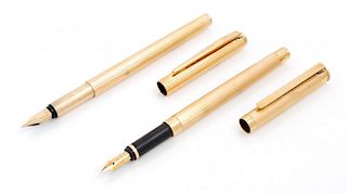 Two Montblanc Gold-Plated Fountain Pens Length 5 1/2 inches.