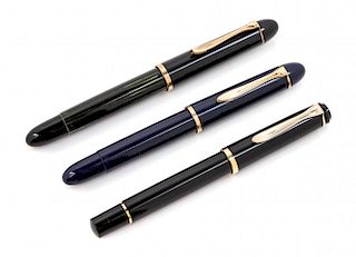 A Collection of Three Pelikan Fountain Pens Length of first 5 1/4 inches.