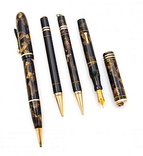 A Collection of Four Vintage Conklin Writing Instruments Length of longest 5 3/4 inches.