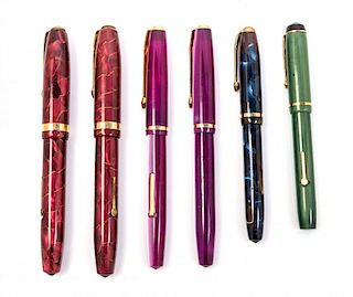 A Collection of Six Conway-Stewart Fountain Pens Length of longest 4 5/8 inches.