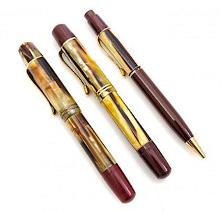 A Group of Three Vintage Pelikan Writing Instruments Length of fountain pens 4 3/4 inches.