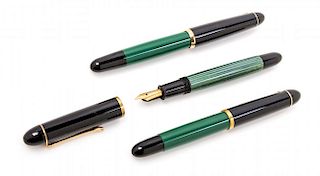 A Collection of Three Pelikan Fountain Pens Length of longest 5 1/4 inches.