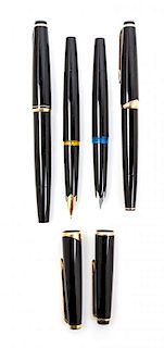 A Collection of Four Montblanc Fountain Pens Length of longest 5 3/8 inches.
