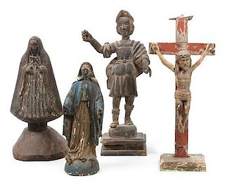 Four Southwestern Carved Wood Bultos Height of tallest 16 3/4 inches.