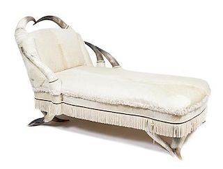 A Steer Horn and Hide Chaise Lounge Height 41 x width 44 x depth 75 inches.