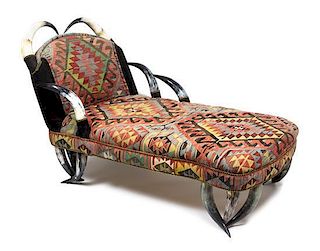 A Steer Horn Upholstered Chaise Lounge Height 40 x width 42 x depth 70 inches.