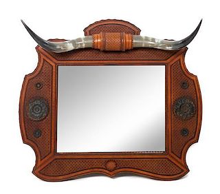 A Longhorn Tooled Leather Mirror Height 35 1/2 x width 39 1/2 inches.