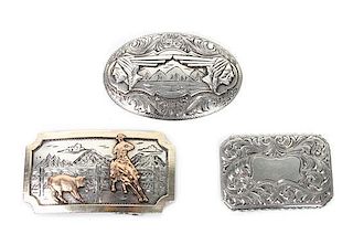 Three Comstock Heritage Sterling Silver Trophy Buckles Height of largest 1 3/4 x width 3 inches.