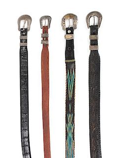 A Collection of Four Western Belts with Silver Ranger Sets Length of belt 39 - 40 inches.