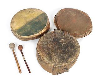 A Wood and Leather Drum and Drumstick Diameter 14 of first 1/4 inches.
