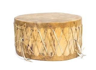 A Contemporary Hide Drum Height 14 x width 28 x depth 26 inches.