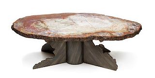 A Fossilized Wood Table Top and Iron X-Form Base Height 19 3/4 x width 33 x depth 61 1/2 inches.