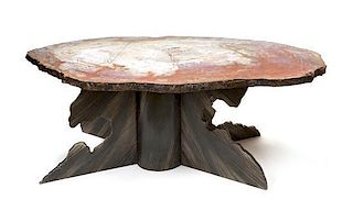 A Fossilized Wood Table Top and Iron X-Form Base Height 19 1/2 x width 37 x depth 61 inches.
