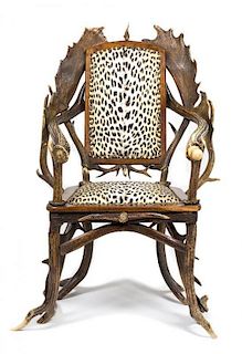 A Continental Oak Antler and Horn Arm Chair Height 42 inches.