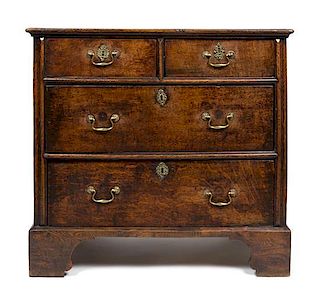An English Chippendale Oak Four Drawer Chest of Drawers Height 33 x width 34 x depth 21 inches.