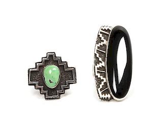 Two Navajo Silver Rings, Tommy Jackson (Navajo, b. 1958) Length of first 2 x width 7/8 inches.