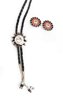 A Zuni Sun Face Silver, Jet, Mother of Pearl, Coral and Turquoise Bolo and Similar Earrings, Diameter of bolo 1 1/2 inches.