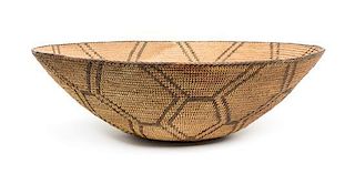 A Pima Basketry Tray Height 5 3/4 x diameter 18 inches.