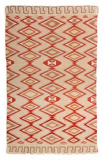 A Navajo Germantown Weaving 56 3/4 x 38 1/2 inches.