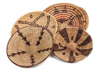 Four Southwestern Basket Trays Diameter of largest 13 1/2 inches.