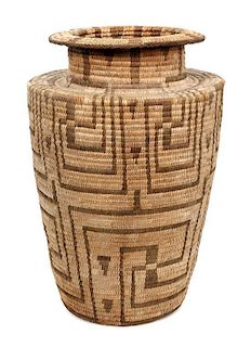 A Pima Basket Olla Height 16 1/2 x diameter 10 1/2 inches.
