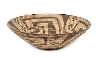 A Pima Basketry Bowl Height 5 1/8 x diameter 16 3/8 inches.