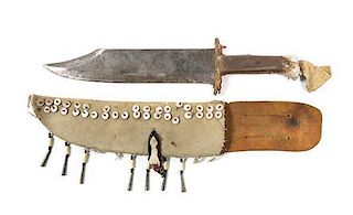 A Southwestern Style Knife with Leather Sheath Length 18 1/2 x width 3 1/2 inches.
