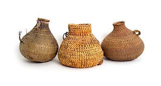 Three Southwestern Bottle Form Baskets Height of tallest 7 inches.