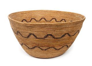 A Mission Indian Basket Bowl Height 10 1/2 x diameter 20 inches.
