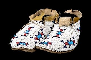 A Pair of Cheyenne Fully Beaded Moccasins Length 10 1/2 inches.