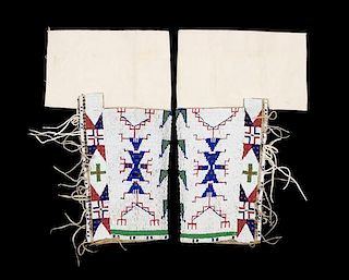 A Pair of Sioux Beaded Leggings Length 17 inches.