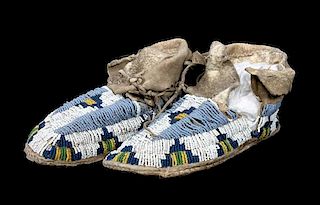 A Pair of Sioux Beaded Moccasins Length 7 1/2 inches.