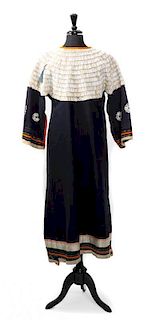 A Cloth and Dentalium Shell Sioux Dress Length approximately 49 x width 17 inches.