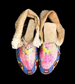 A Pair of Northern Plains Quillwork and Beaded Moccasins Length 10 inches.
