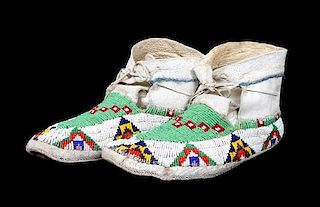 A Pair of Beaded Sioux Moccasins Length 9 3/4 inches.