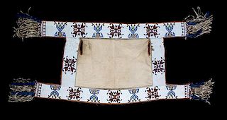 A Sioux Beaded Canvas Saddle Blanket Length approximately 55 1/2 x width27 inches.