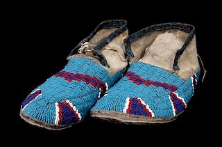 A Pair of Beaded Northern Plains Moccasins Length 10 1/2 inches.