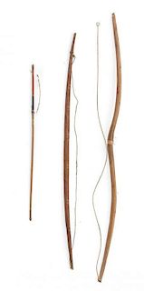 Two Native Bows and an Arrow Length longest bow 46 1/4 inches.