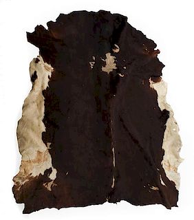 Three Native Tanned Hides Length of largest approximately 82 x 71 inches.