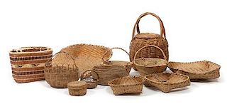 Twelve Native Made Baskets Length of largest 22 x width 18 inches.