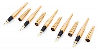 A Group of Five S.T. Dupont Gold-Plated Ellipsis Fountain Pens