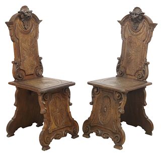 (2) RENAISSANCE REVIVAL STYLE CARVED OAK HALL CHAIRS