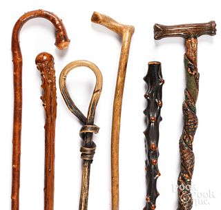 Six carved canes